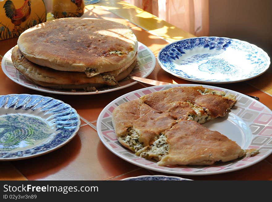 Four plates in the kitchen with breakfast