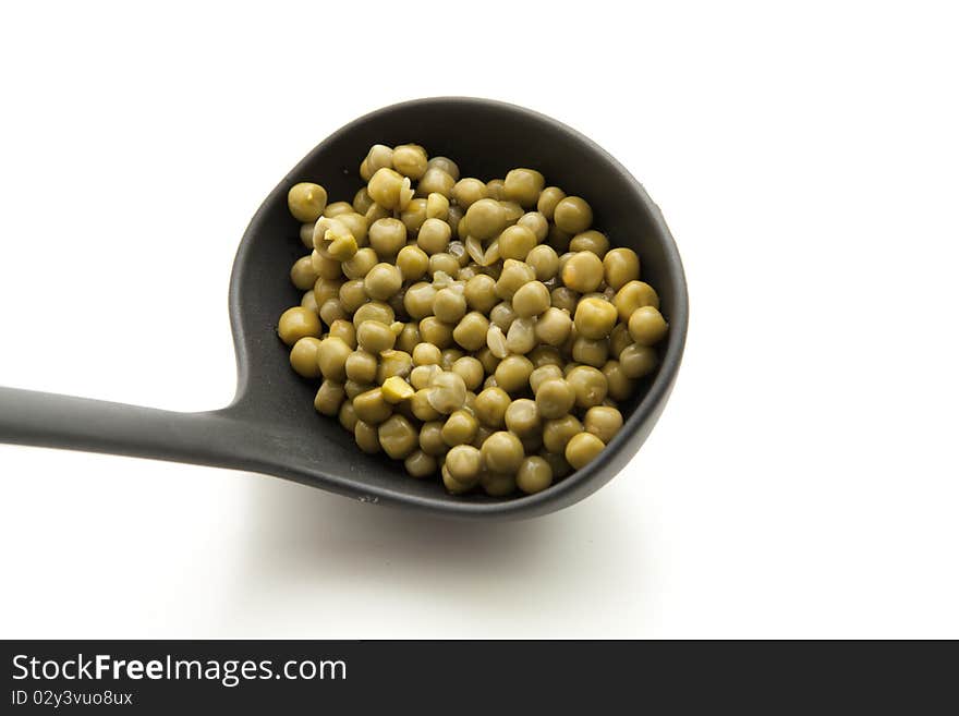 Ladle with peas