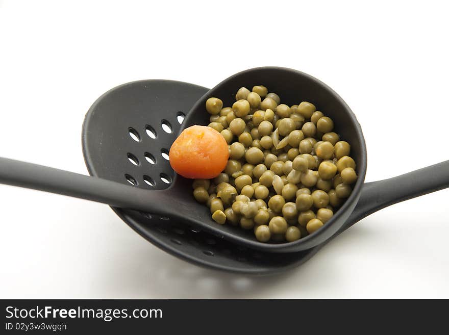 Ladle with peas