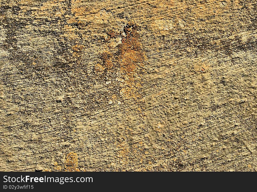 Old orange surface stone wall. Old orange surface stone wall