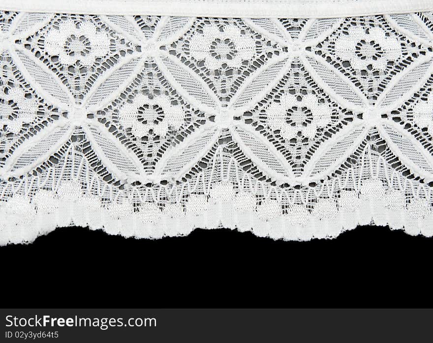 White lace with pattern in the manner of flower on black background