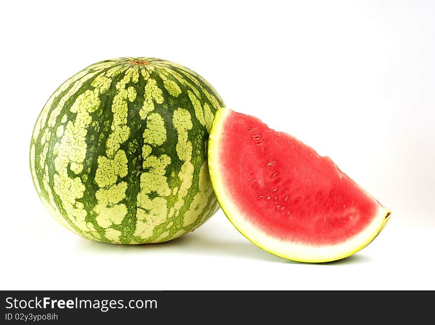 Piece cut out of watermelon on the white background. Piece cut out of watermelon on the white background