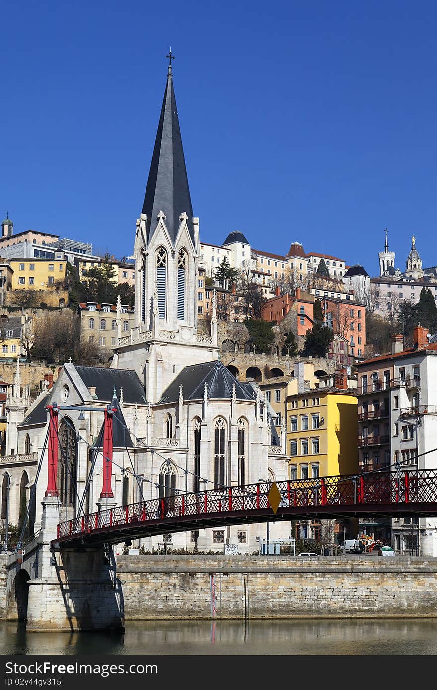 Red footbridge and church