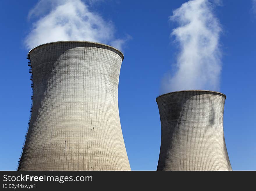 Chimney of nuclear industry and blue sky. Chimney of nuclear industry and blue sky