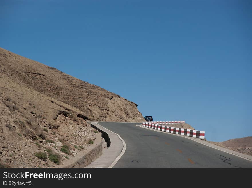 Yellowish mountain road view in tibet of China