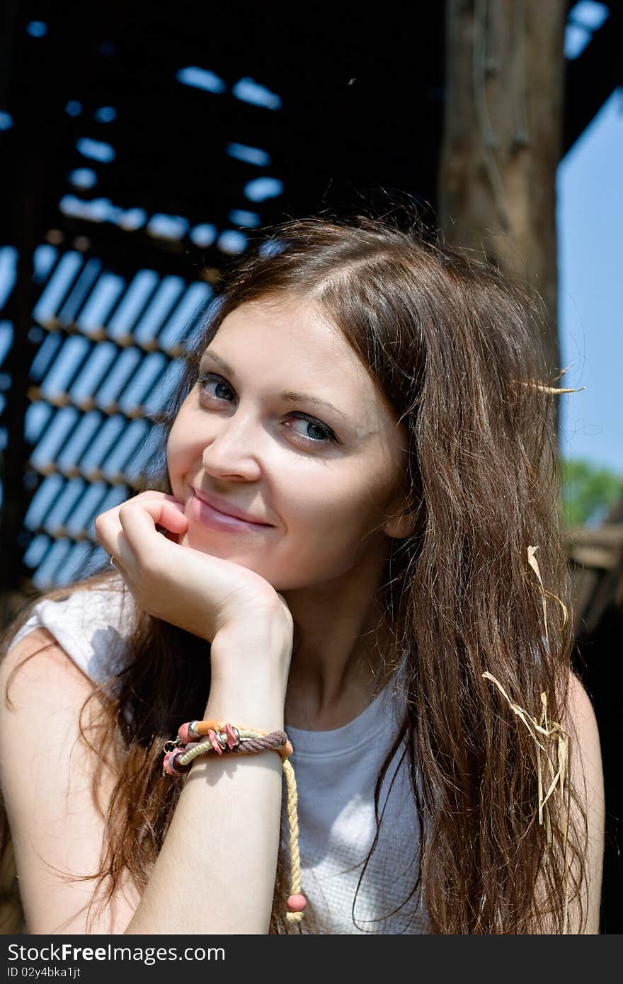 Close-up of young woman with straw in hair