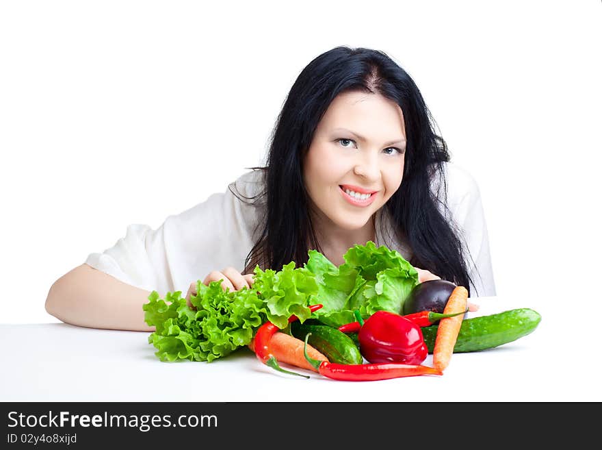 Beautiful woman with vegetables over white background. Beautiful woman with vegetables over white background