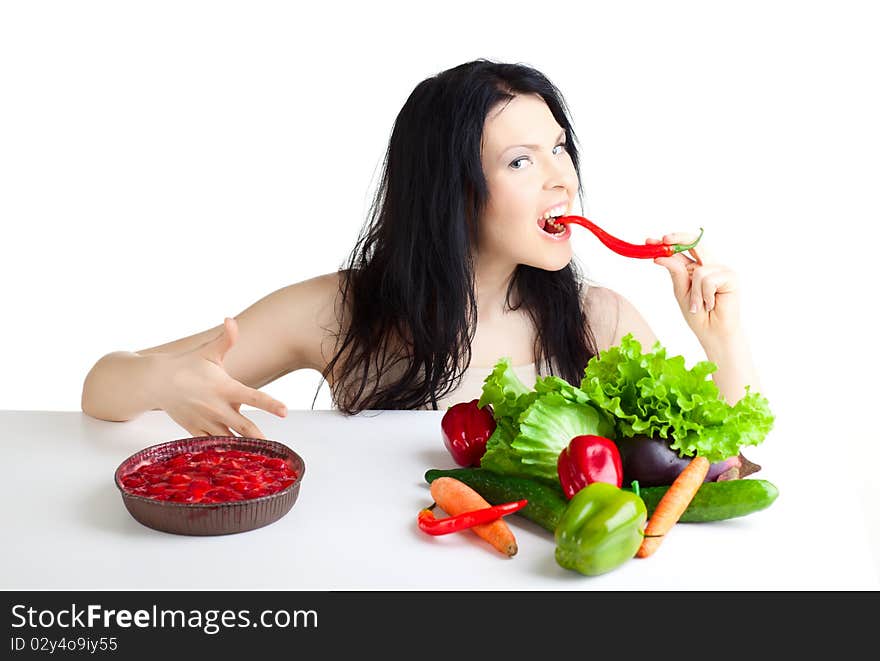 Beautiful woman with vegetables over white background. Beautiful woman with vegetables over white background