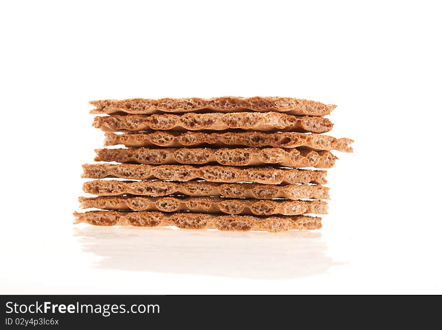 Pieces of dry bread crackers on a white background. Pieces of dry bread crackers on a white background