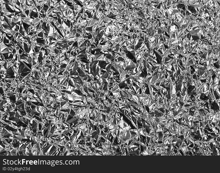 A crumpled foil background or texture. A crumpled foil background or texture