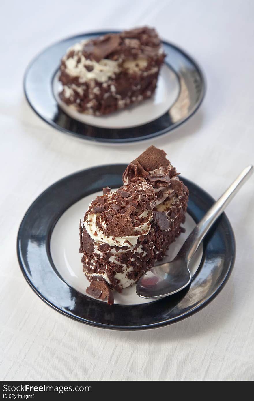 Two chocolate deserts on table ready to be served