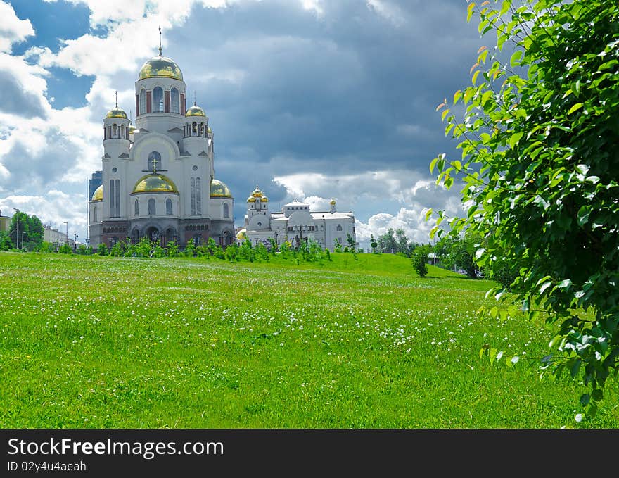 Horizontal imafe of beauty church on green meadow