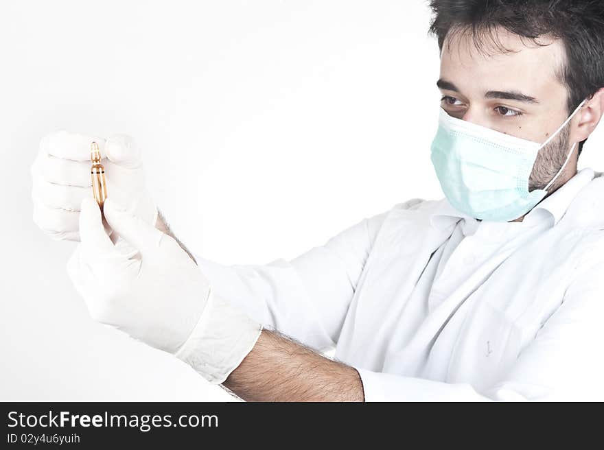 Doctor looking at ampule or vial isolated on white. Doctor looking at ampule or vial isolated on white