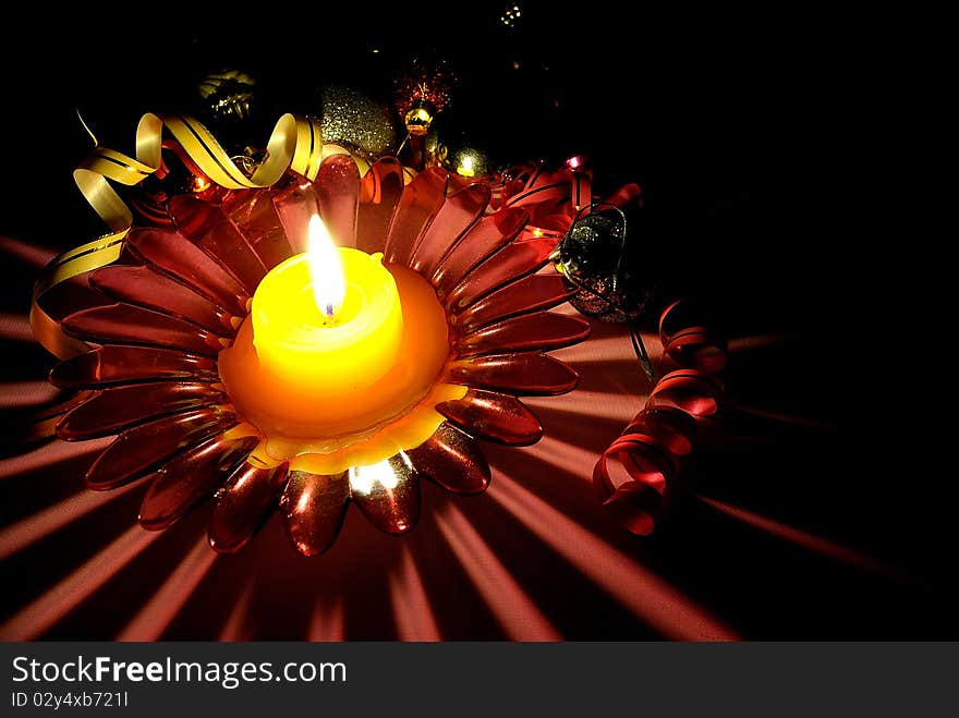 Candlestick with a candle and adornments