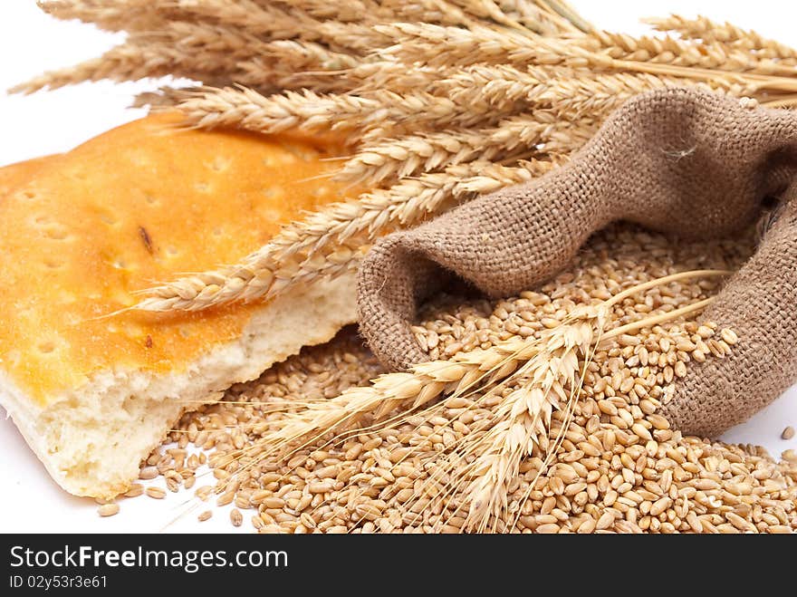 Bread a bag with wheat and ears on white