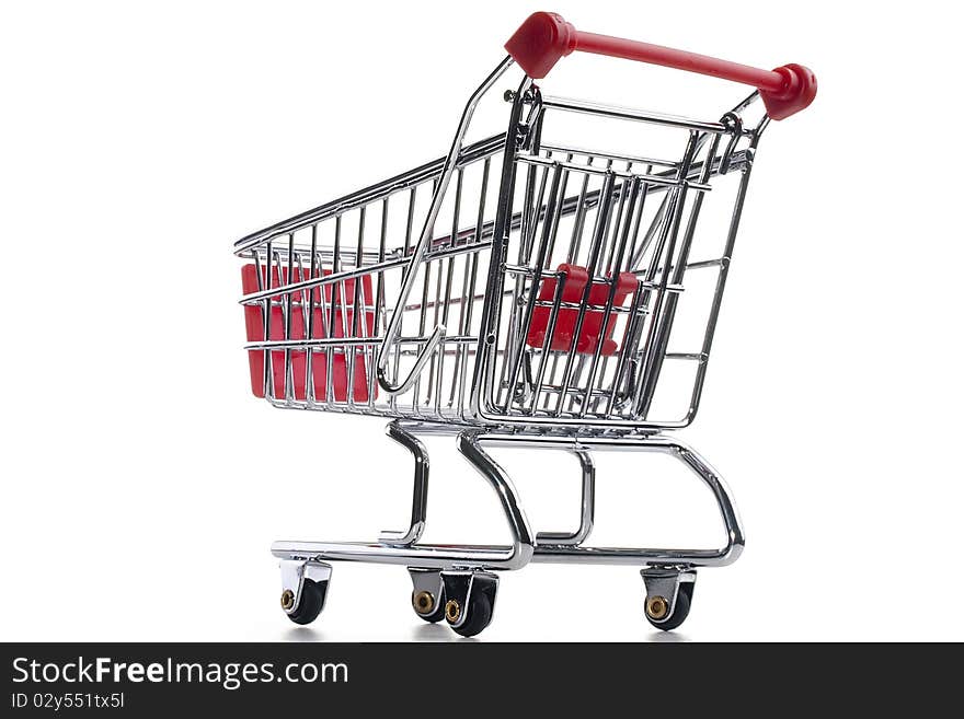 Empty shopping cart with the red handle on a white background.