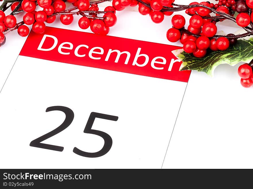 Calendar Date of 25 December with seasonal holly and red berries. Calendar Date of 25 December with seasonal holly and red berries