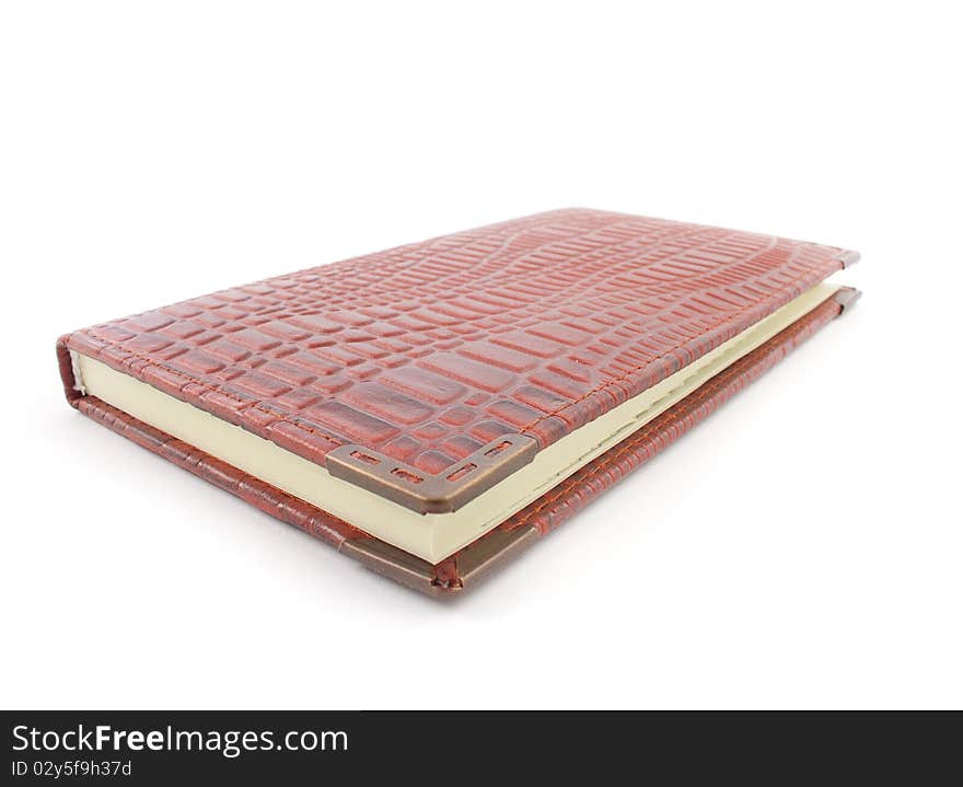 Brown isolated closed book over white background