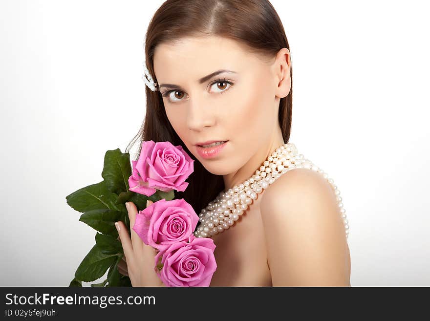 Young beautiful woman with flowers roses. Young beautiful woman with flowers roses