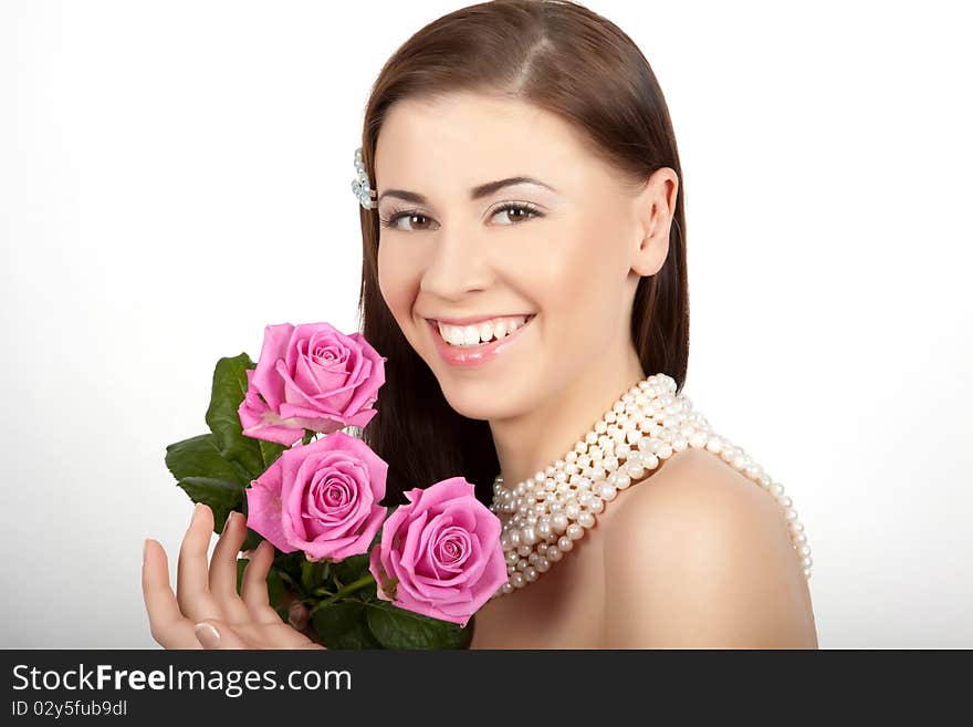 Young beautiful woman with flowers roses. Young beautiful woman with flowers roses