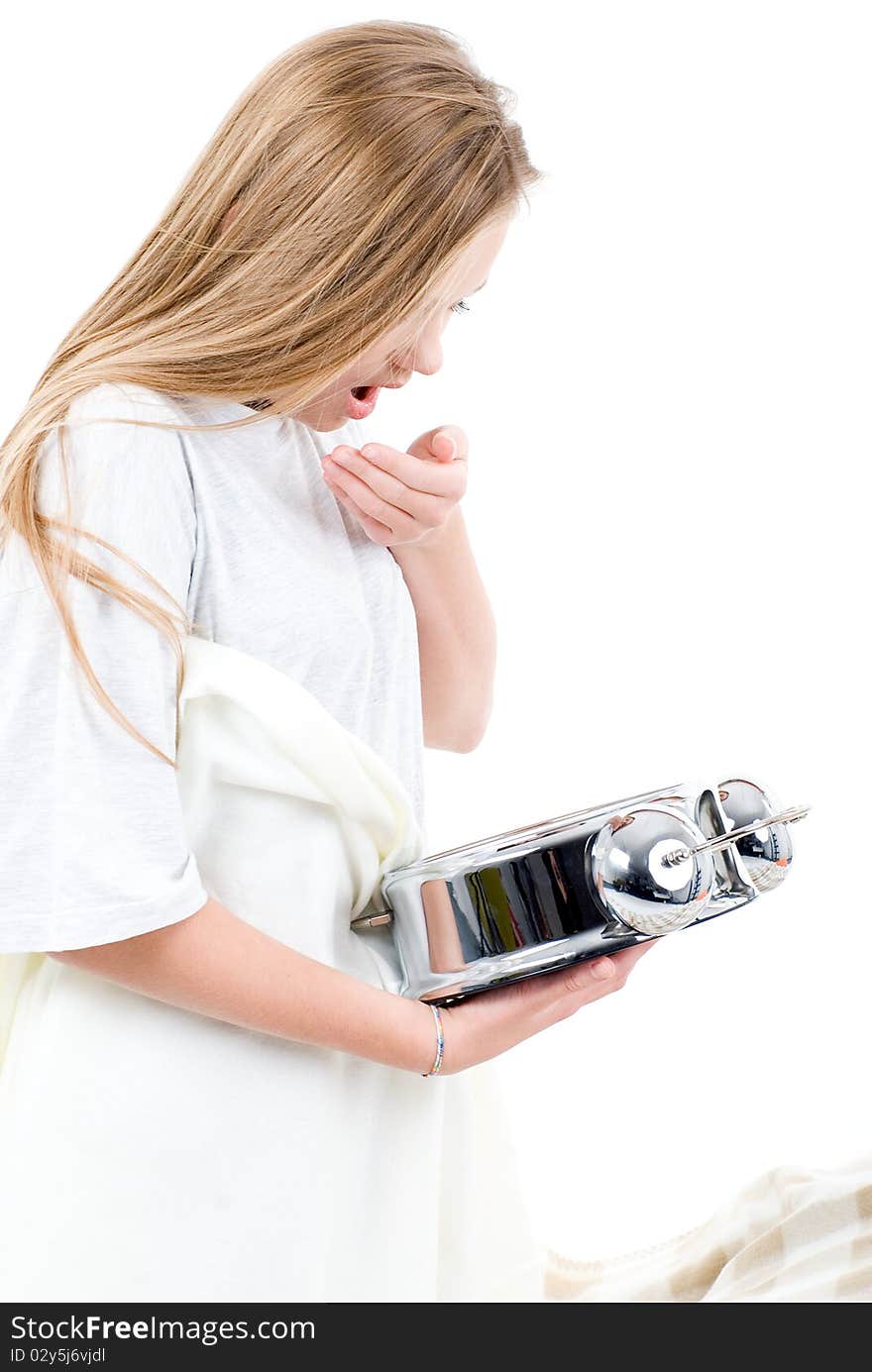 Young blond girl woken up by alarm clock is yawning. Young blond girl woken up by alarm clock is yawning.