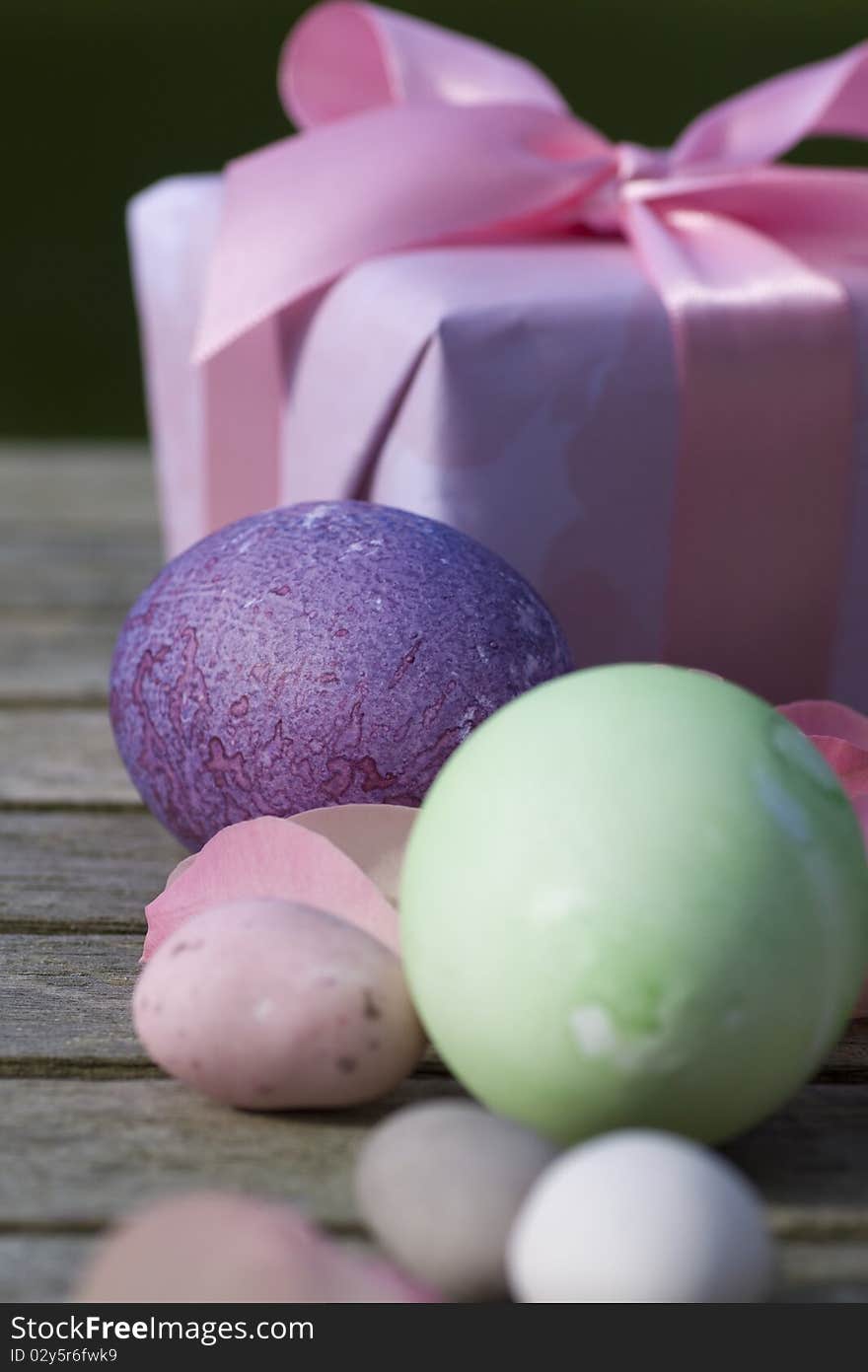 Easter eggs in pastel color with a gift modern deco