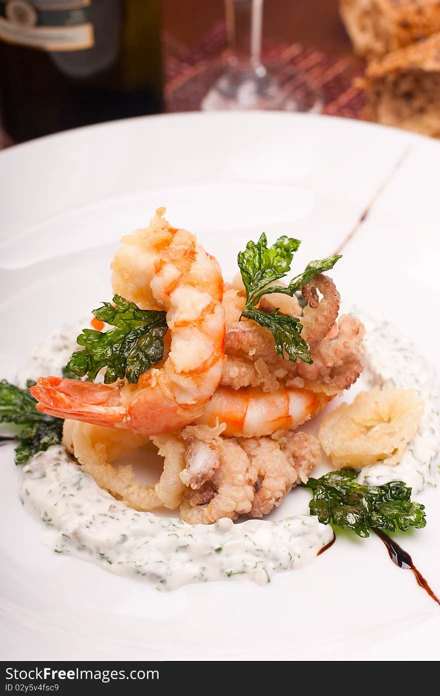 Delicatessen dish with seafoods, shrimps and  octopuses