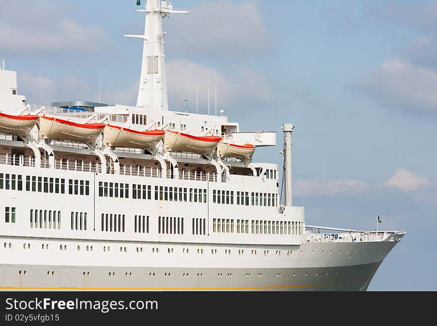 Luxury white cruise ship on a clear day