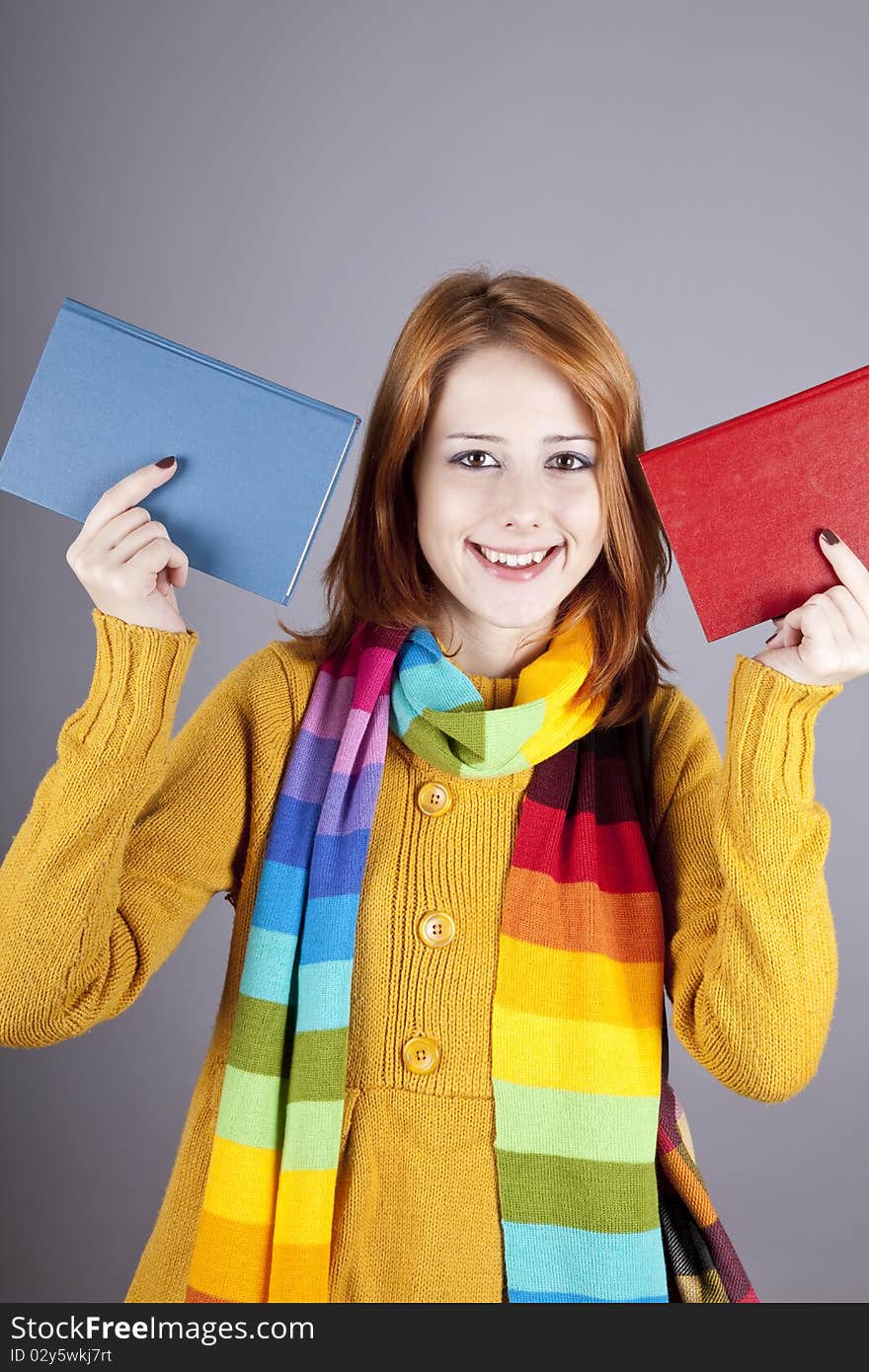 Student girl with two books. Studio shot.