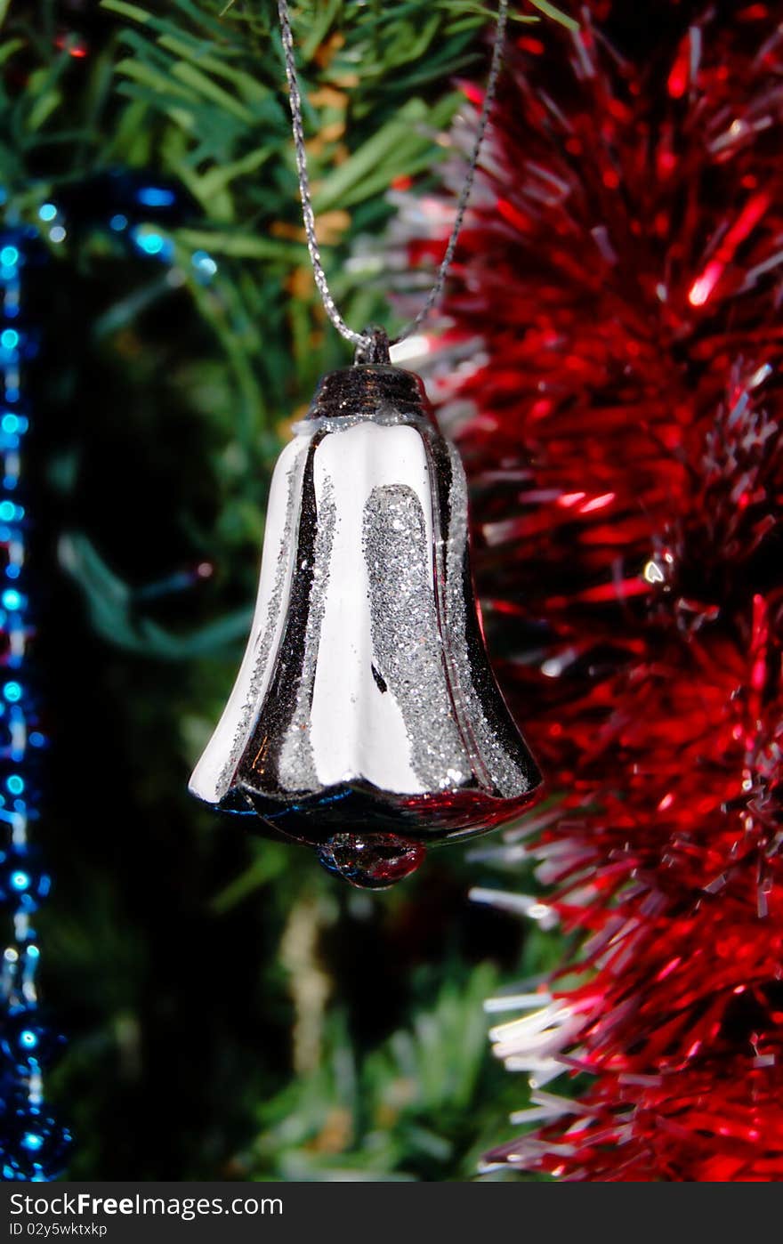 Christmas background: white bell in the Christmas tree!