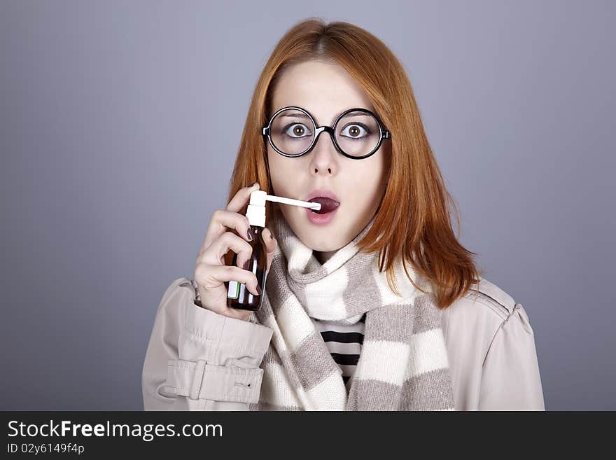 Chill Red-haired Girl In Glasses With Spray.