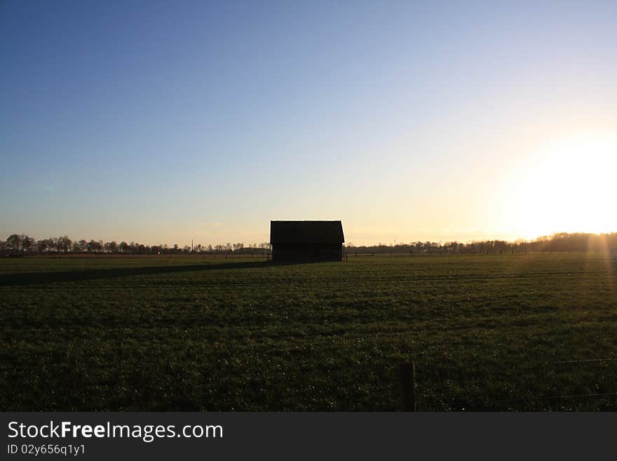 Farming Shed with shadow at sundown