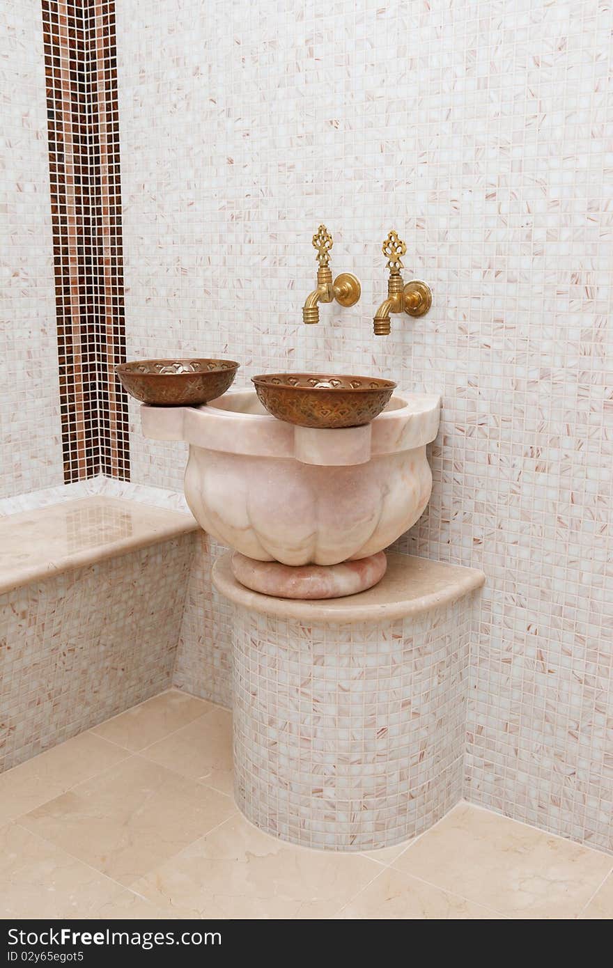 Two faucets and two copper bowl in turkish bath. Two faucets and two copper bowl in turkish bath