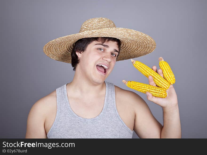 Funny farmer in cap with three corns.