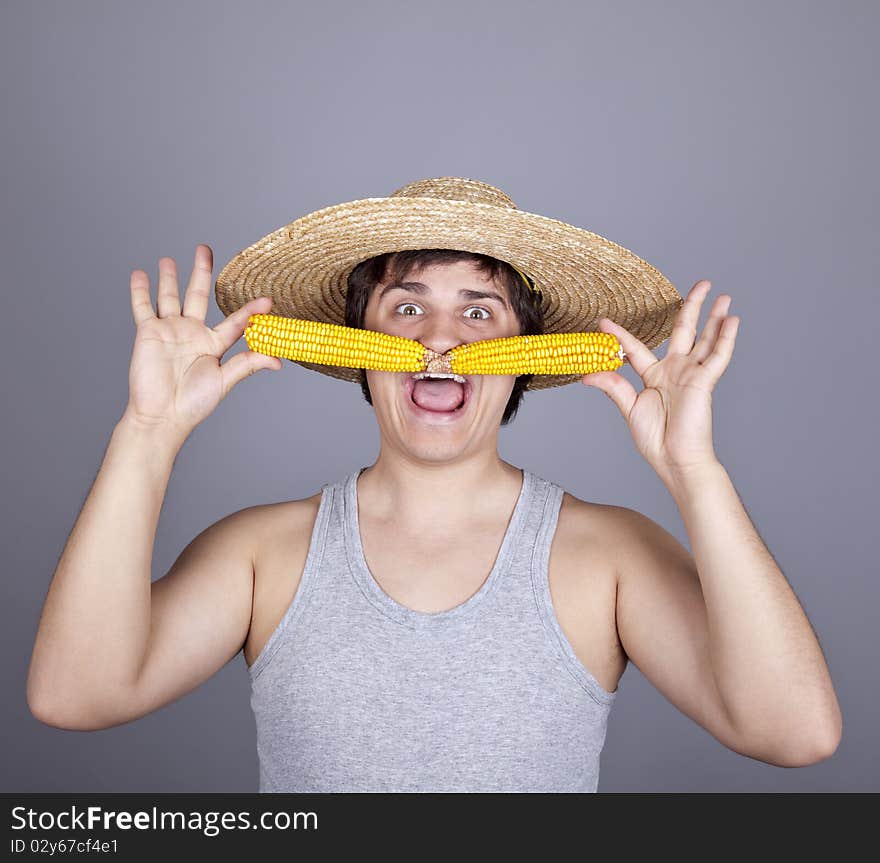 Funny farmer in cap with two corns.