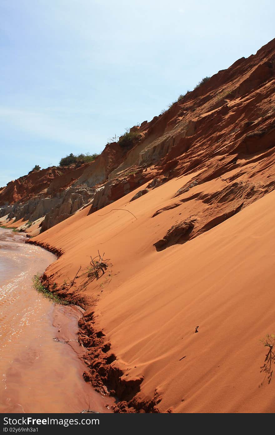 Red sand at a red river. Red sand at a red river