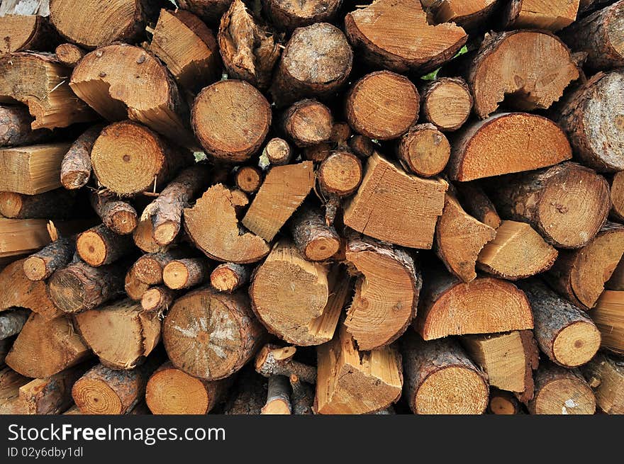 Logs of firewood in a nice stack, all piled up together. Logs of firewood in a nice stack, all piled up together.