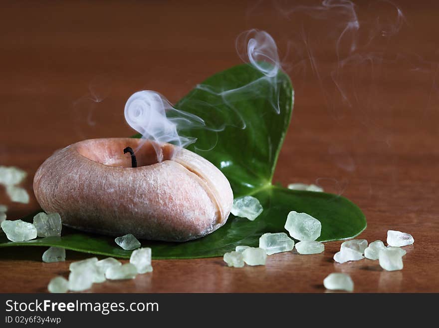 Spa setting with smoking candle