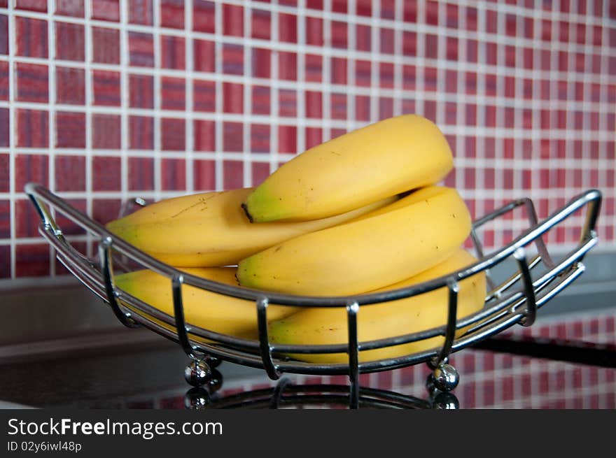 Fresh bananas on metal rack