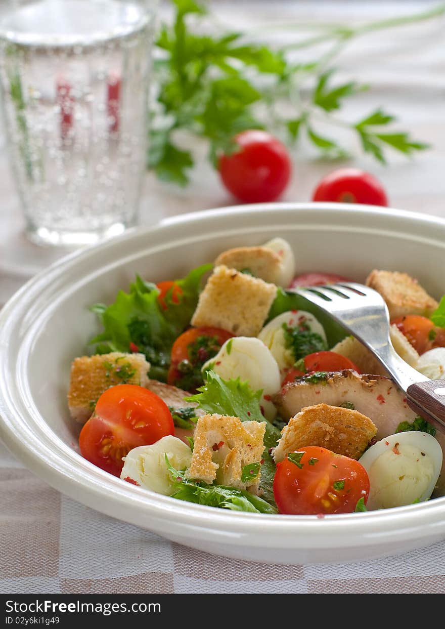 A grilled chicken salad with crunchy croutons. Healthy and delicious!