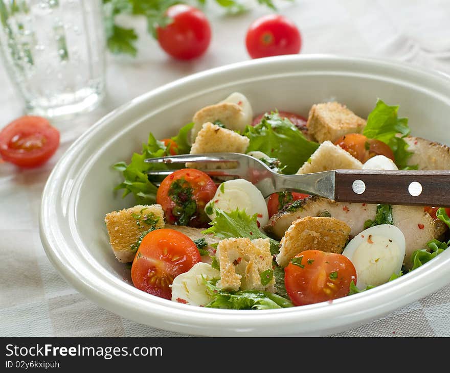 A grilled chicken salad with crunchy croutons. Healthy and delicious!