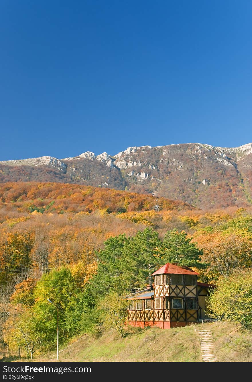 Shooting house in forest at the foot of mountain