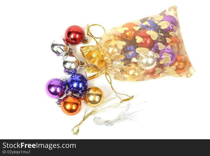 Christmas colorful balls in golden bag, on white. Christmas colorful balls in golden bag, on white