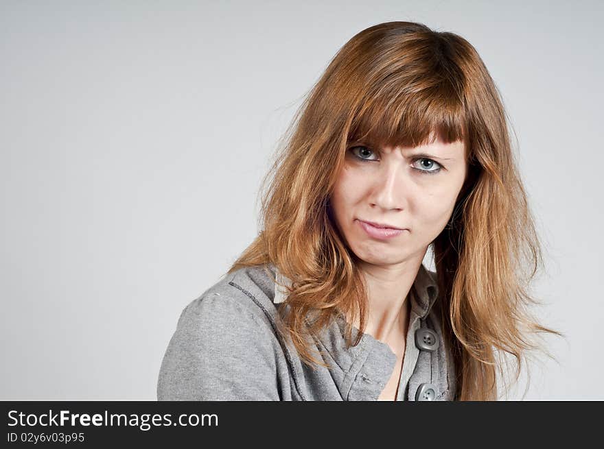 Portrait of blonde girl doubtful