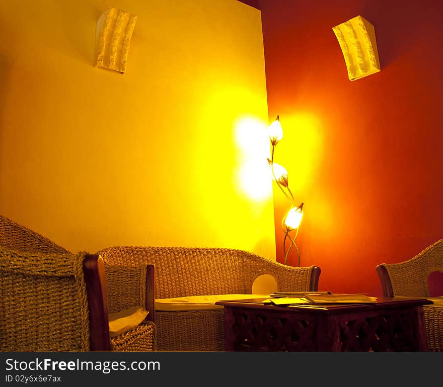 Table and wicker chairs in a pub