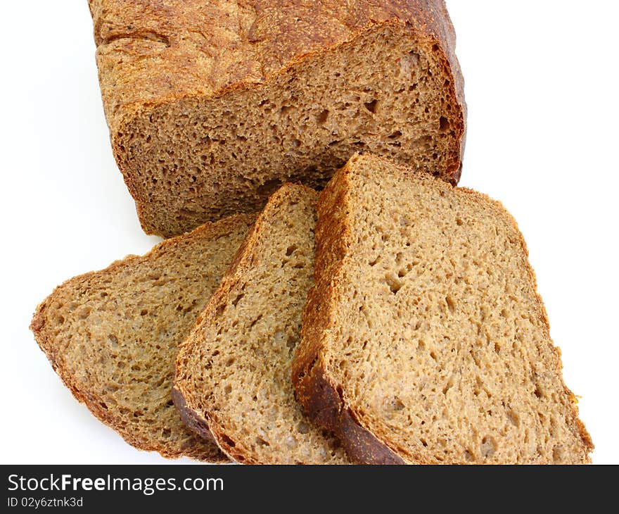 Black rye bread with the fried crust is isolated on a white background