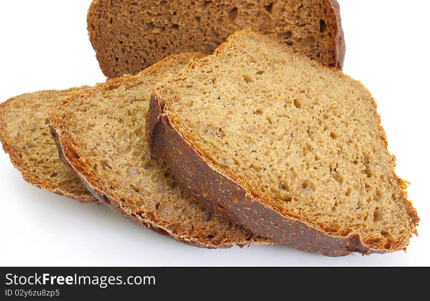 Black rye bread with the fried crust is isolated on a white background