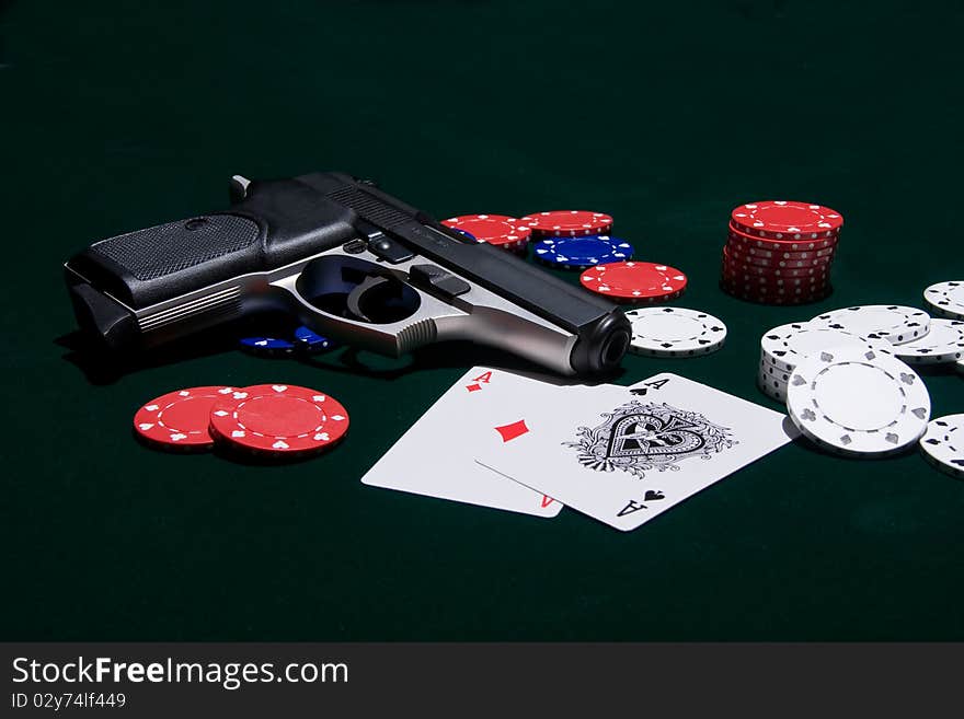 Iconic combination of cards, chips and a handgun. Iconic combination of cards, chips and a handgun.