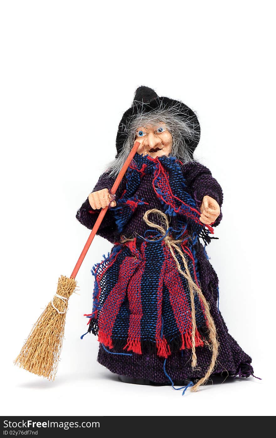 Old Halloween witch with broomstick and hat isolated on white background