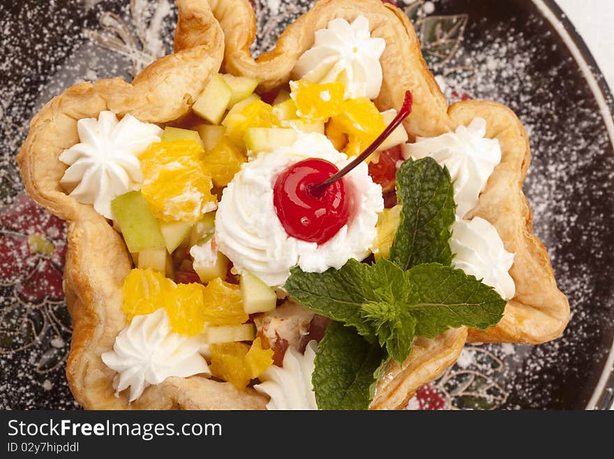 Baked basket cake and maraschino cherry